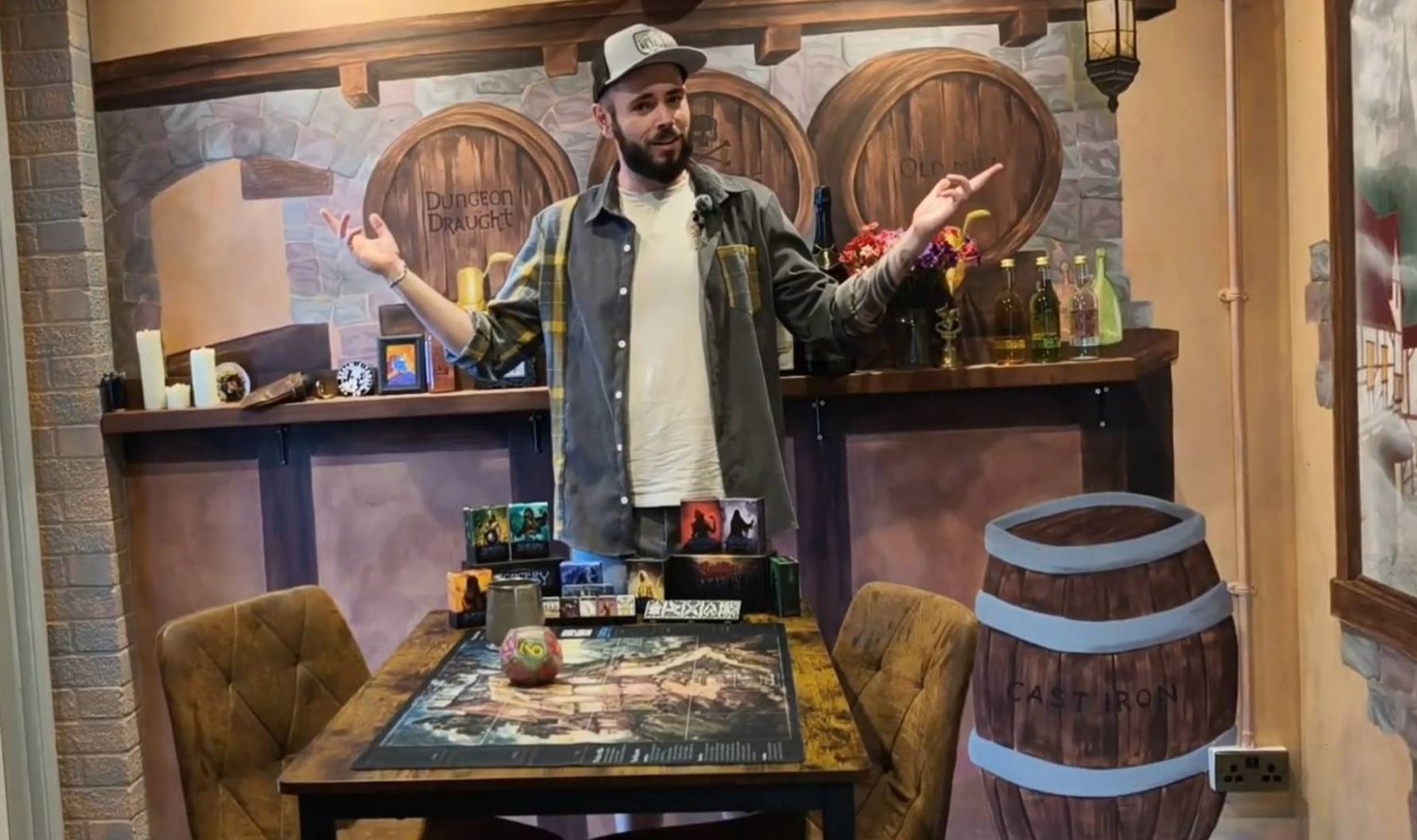 James standing inside his very own Donnybrook Inn, his local game shop "The Game Room".